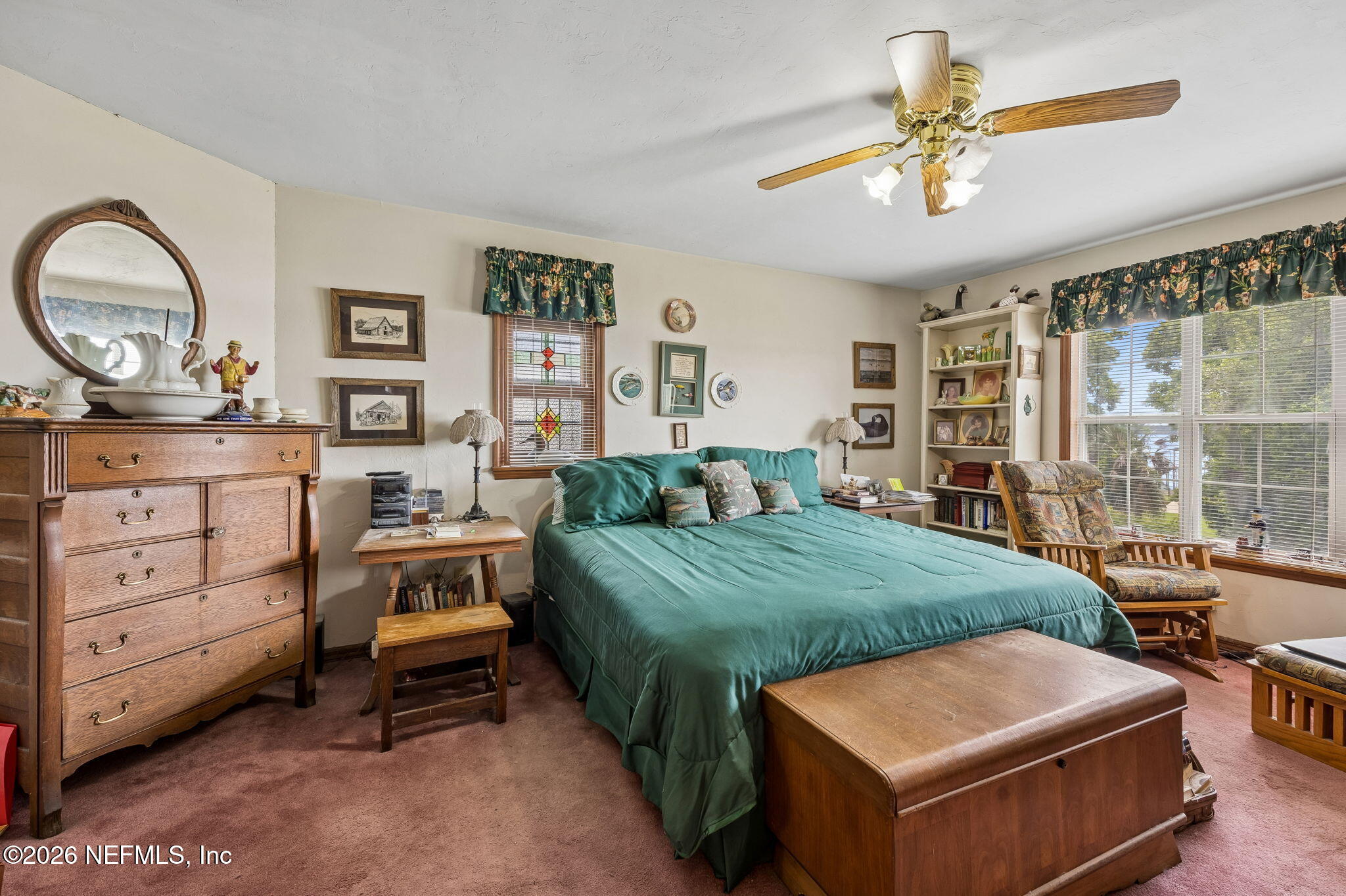 7430 Southwest County Road 18 Hampton, FL 32044 - Photo 32 of 72 a bed room with a bed and a chandelier