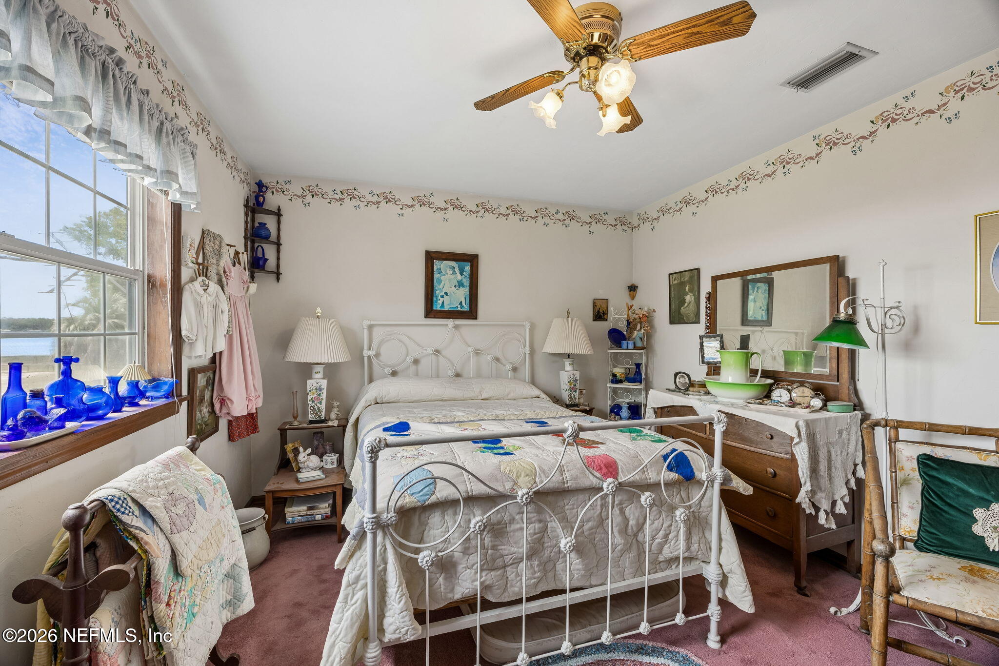 7430 Southwest County Road 18 Hampton, FL 32044 - Photo 38 of 72 a bed room with a bed furniture and a chandelier