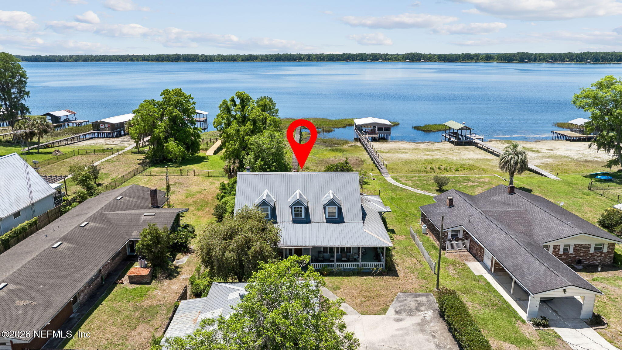 7430 Southwest County Road 18 Hampton, FL 32044 - Photo 57 of 72 a aerial view of a house with outdoor space and lake view