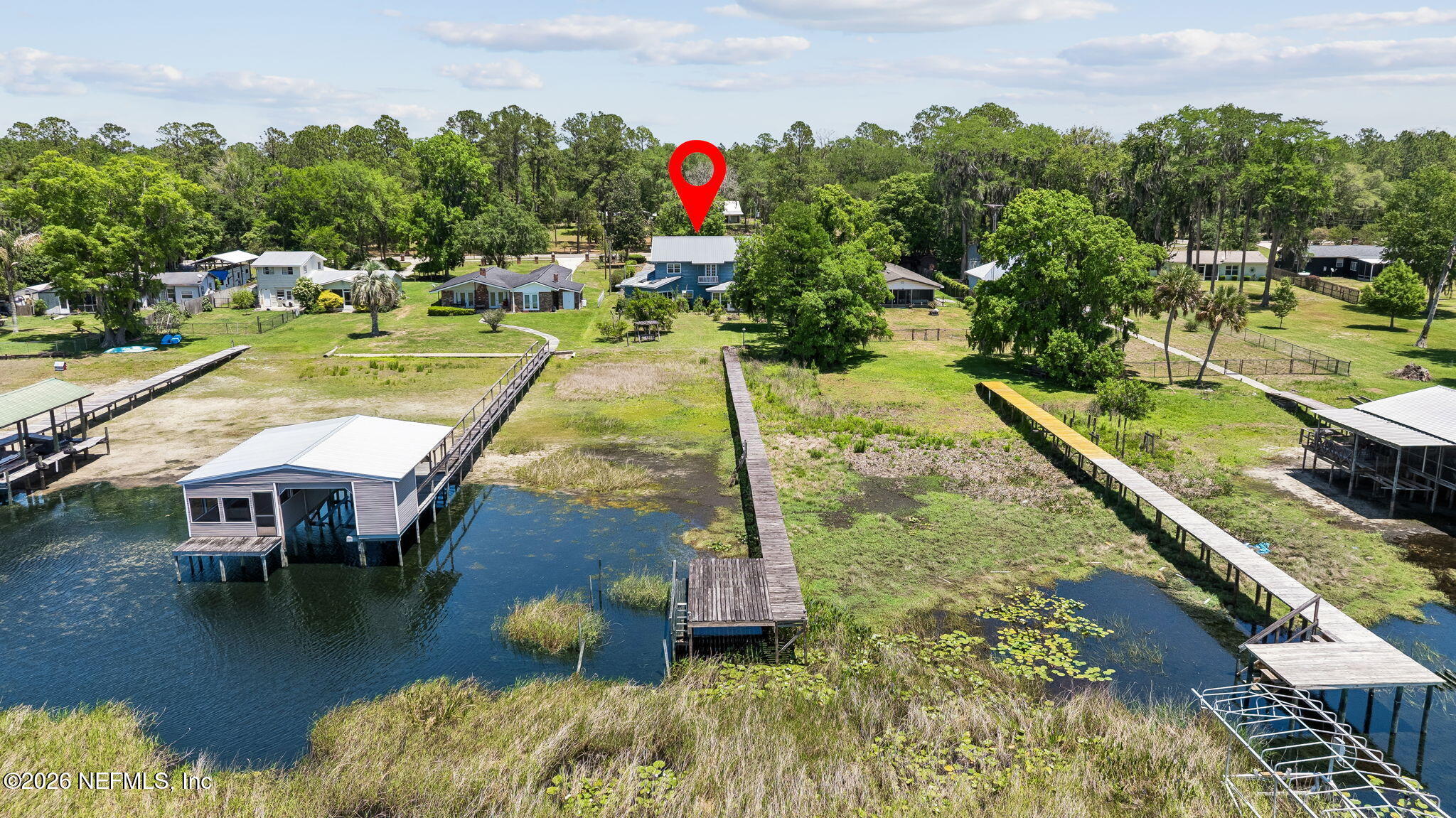 7430 Southwest County Road 18 Hampton, FL 32044 - Photo 59 of 72 a view of a swimming pool with a patio and a garden