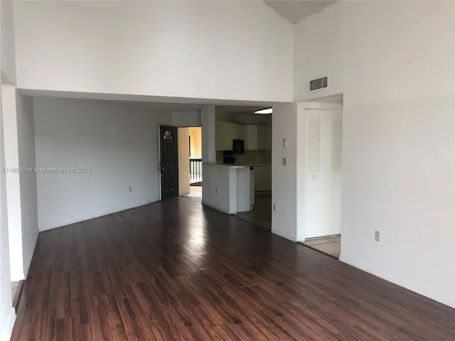 a view of a kitchen with a sink and a stove