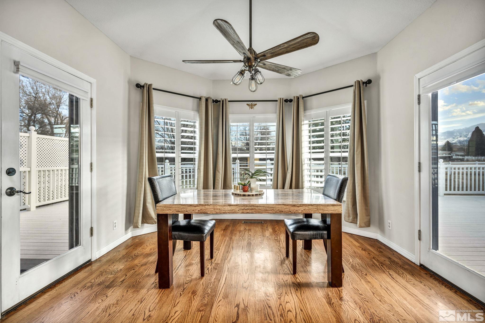 9811 Dixon Lane Reno, NV 89511 - Photo 13 of 40 a view of a dining room with furniture window and wooden floor
