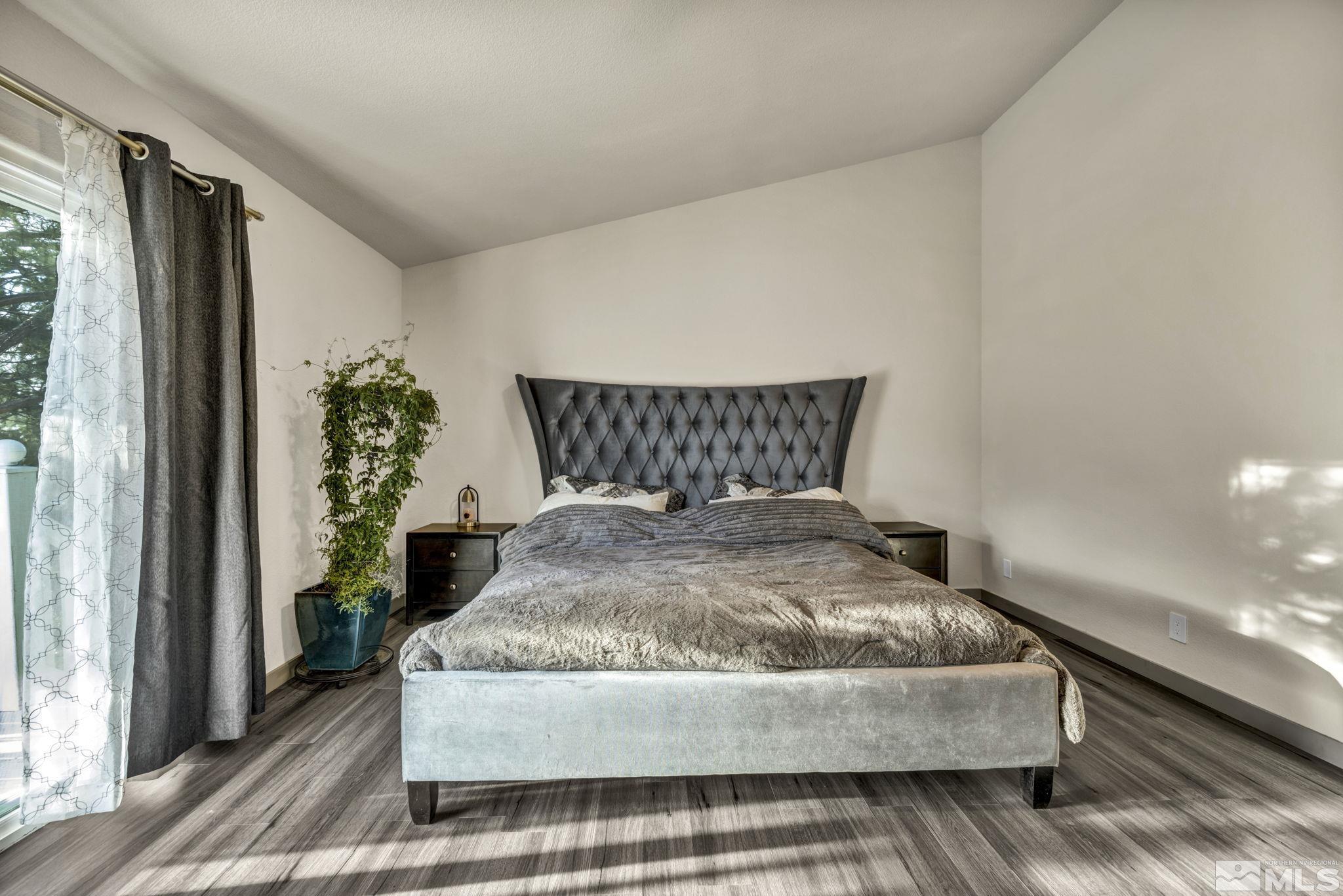 9811 Dixon Lane Reno, NV 89511 - Photo 15 of 40 a bedroom with a bed and window