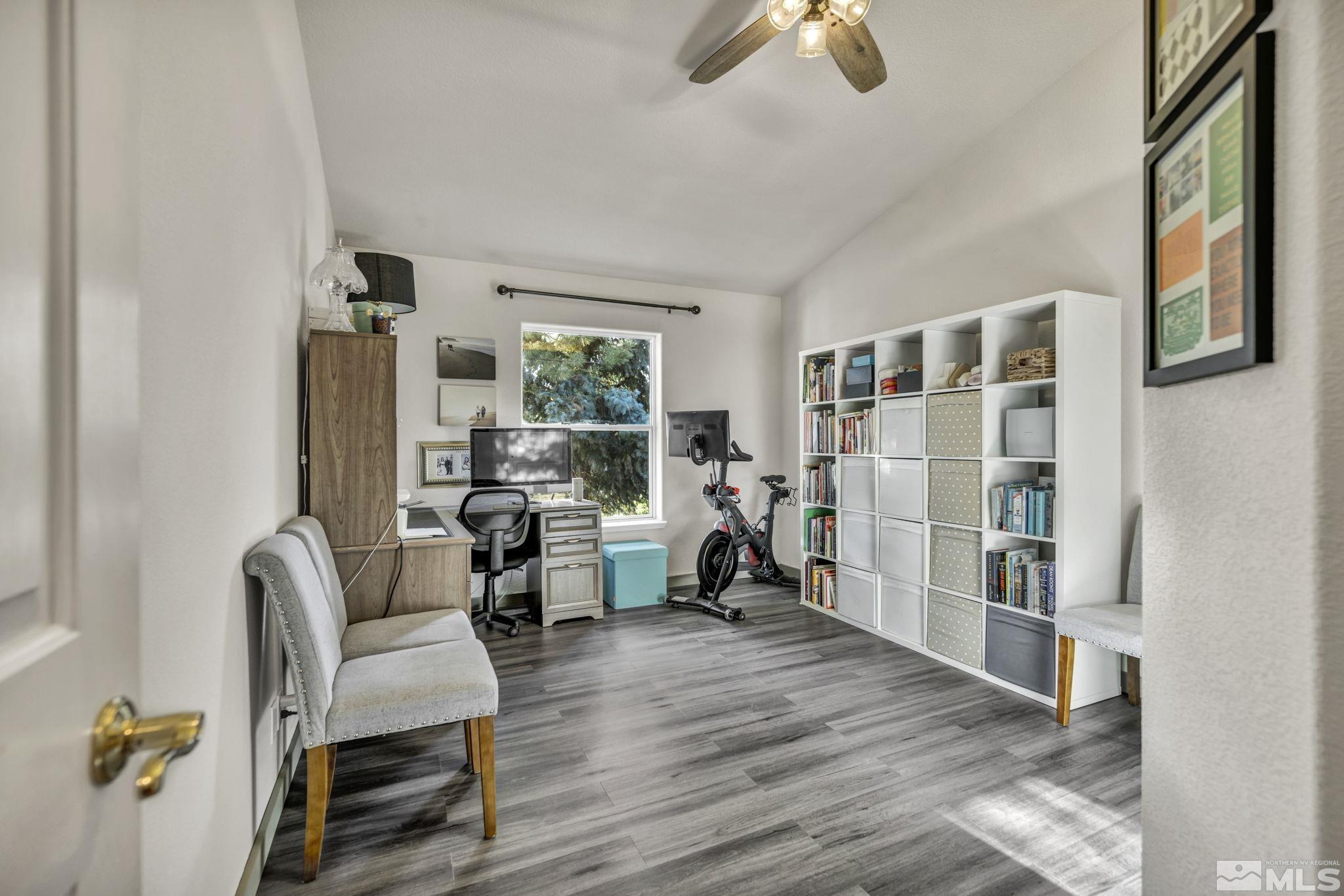 9811 Dixon Lane Reno, NV 89511 - Photo 18 of 40 a living room with furniture a rug and a window