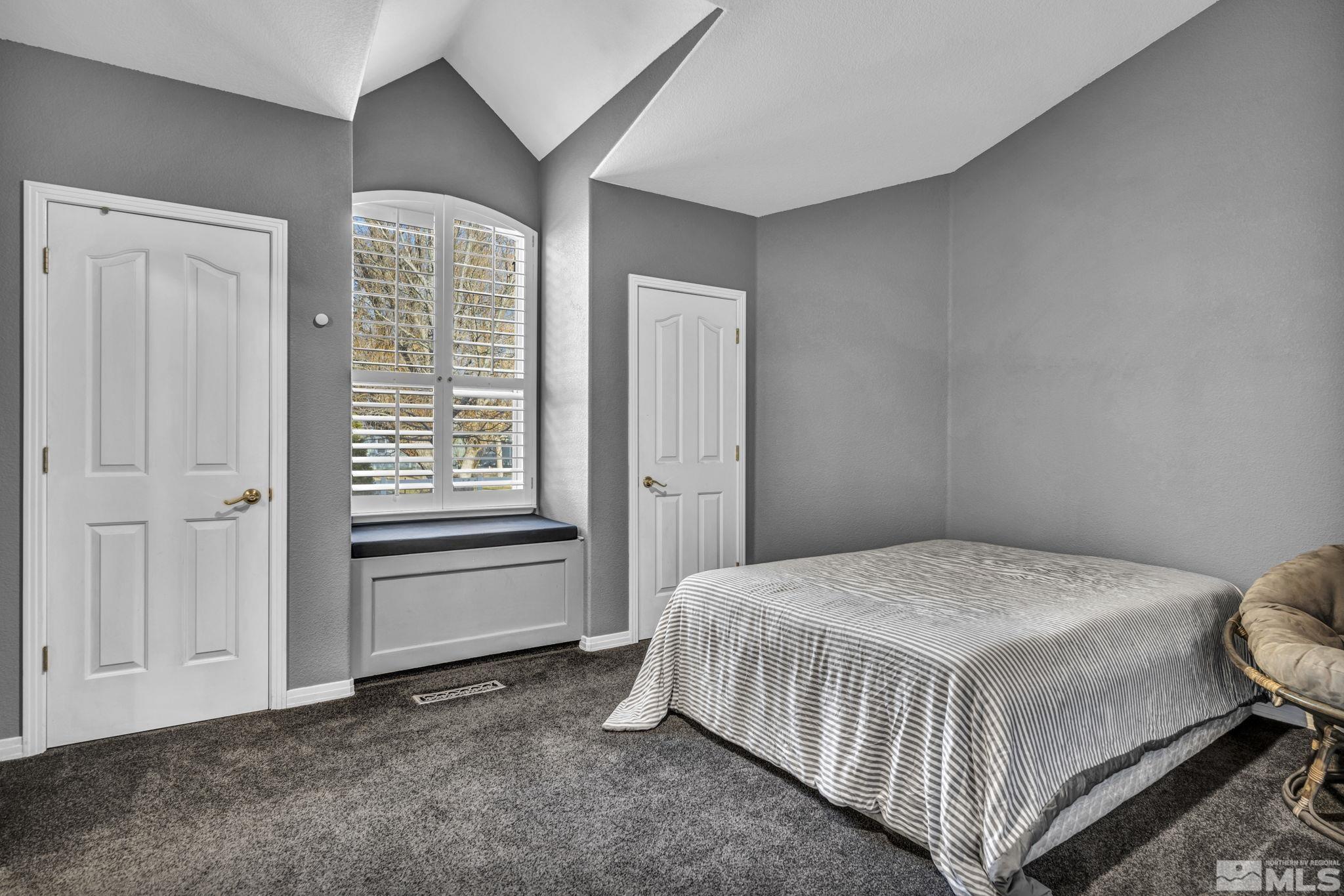 9811 Dixon Lane Reno, NV 89511 - Photo 22 of 40 a bedroom with a bed and a window