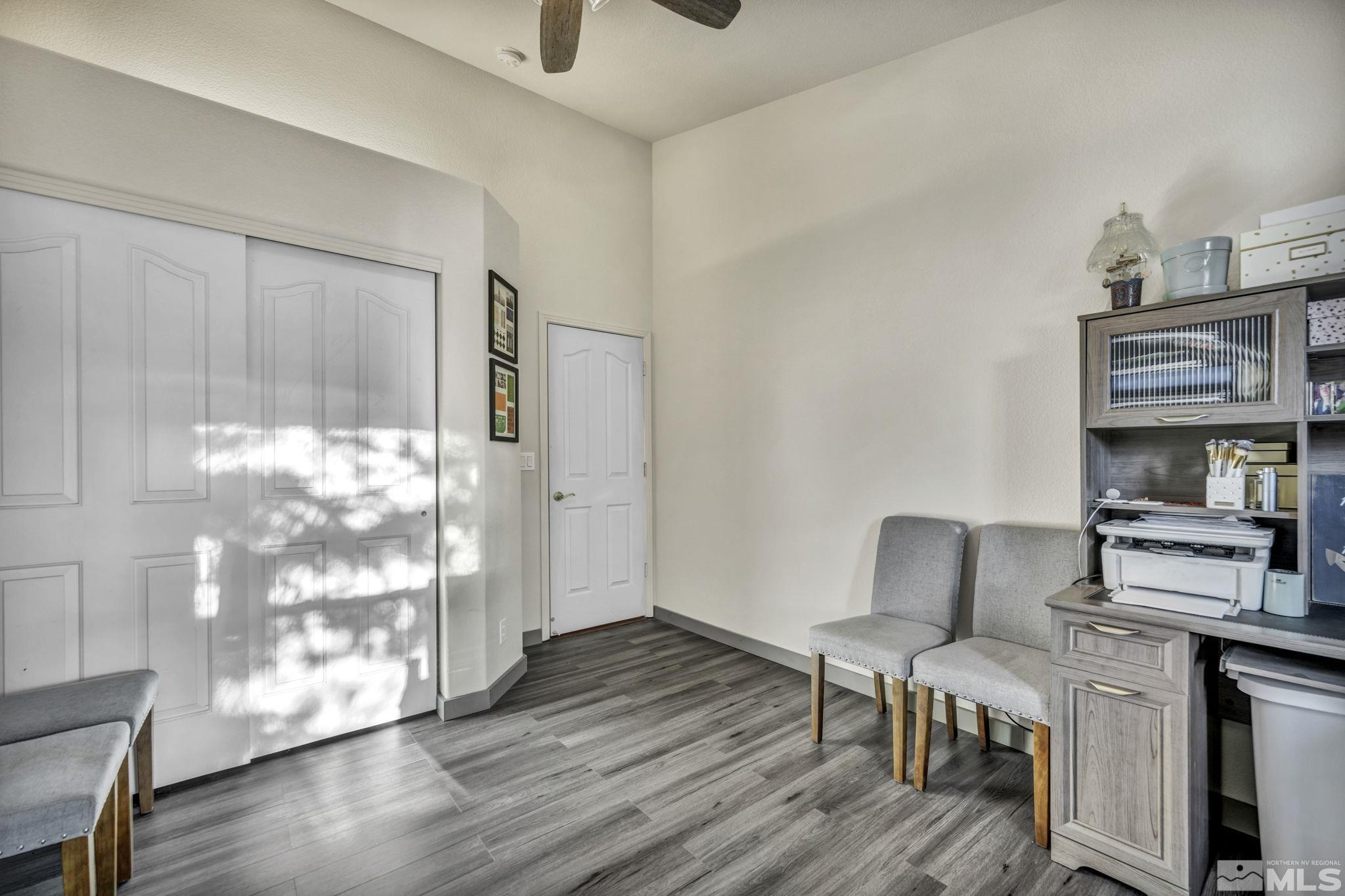 9811 Dixon Lane Reno, NV 89511 - Photo 23 of 40 a living room with furniture and wooden floor