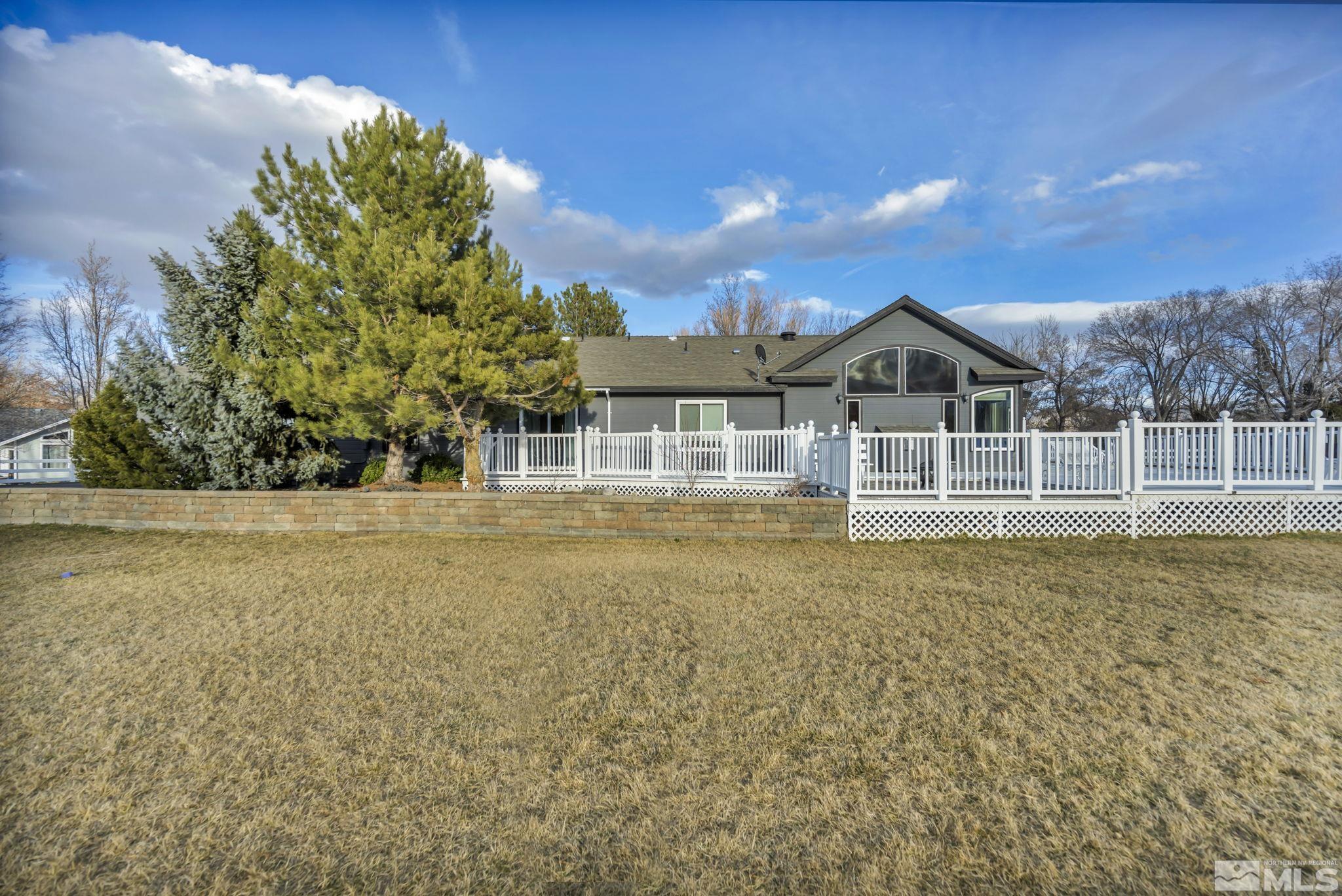 9811 Dixon Lane Reno, NV 89511 - Photo 24 of 40 a view of house with a garden