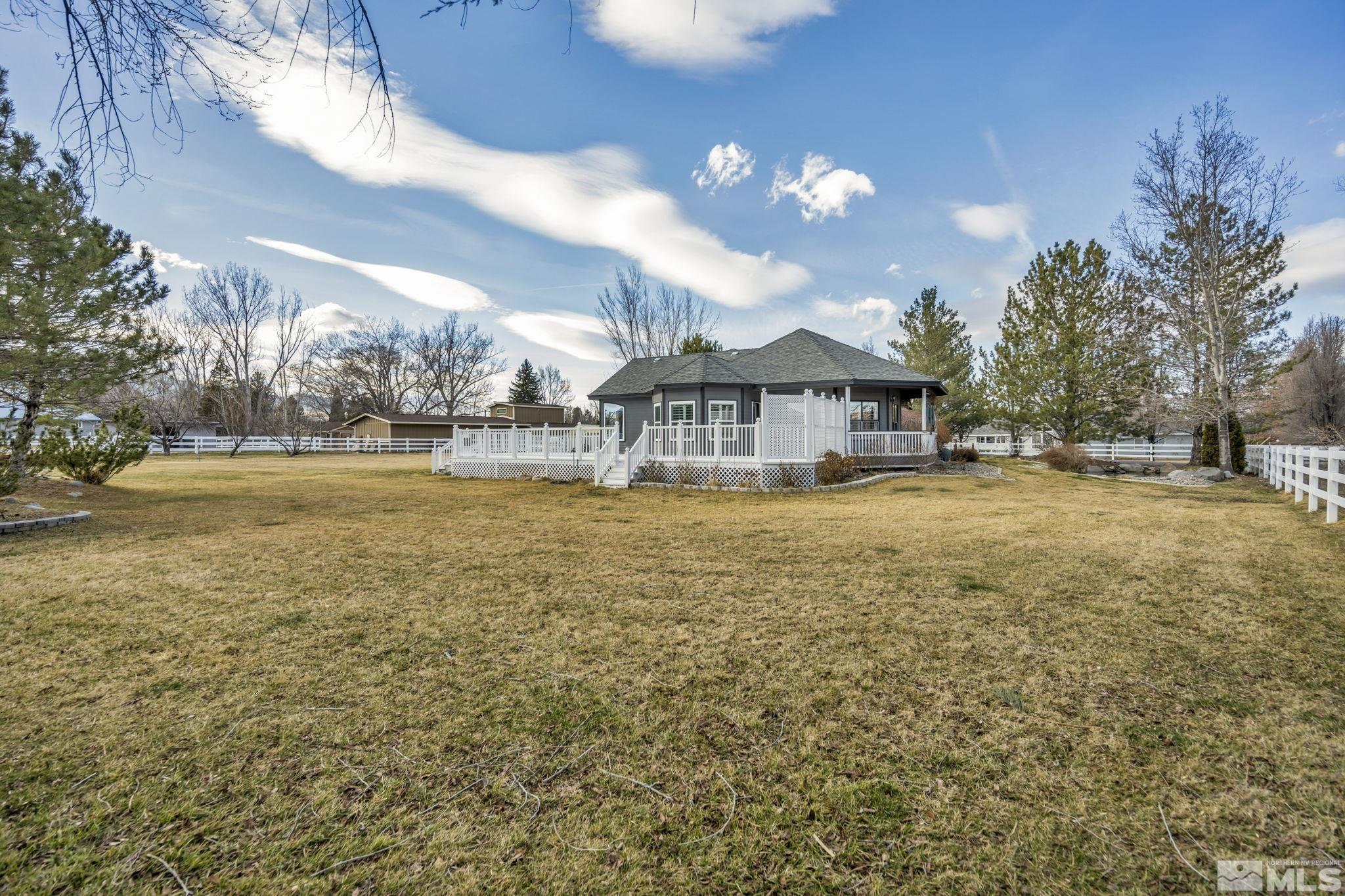9811 Dixon Lane Reno, NV 89511 - Photo 27 of 40 a view of a large pool with an outdoor space and seating area