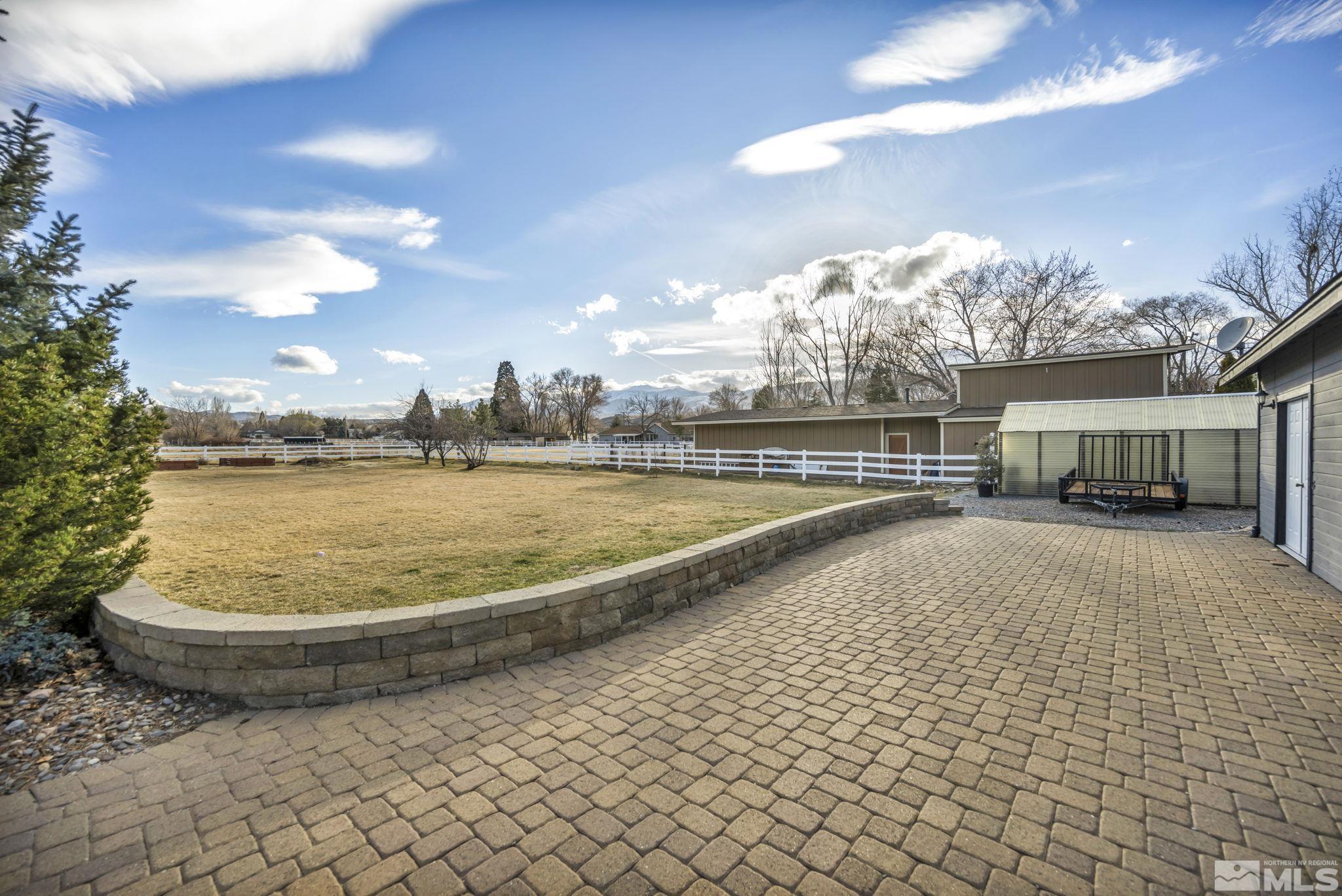 9811 Dixon Lane Reno, NV 89511 - Photo 28 of 40 a view of a swimming pool and a yard