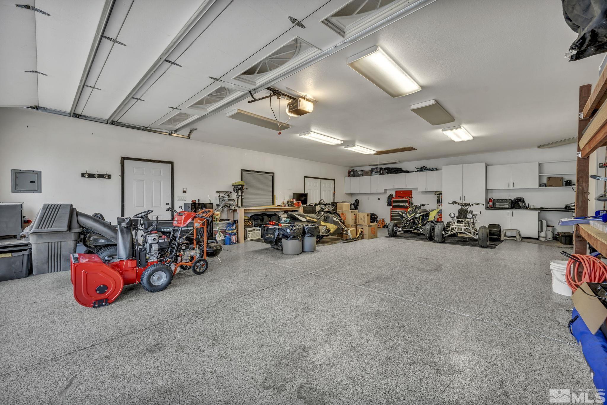 9811 Dixon Lane Reno, NV 89511 - Photo 31 of 40 a view of a garage with a bike and car