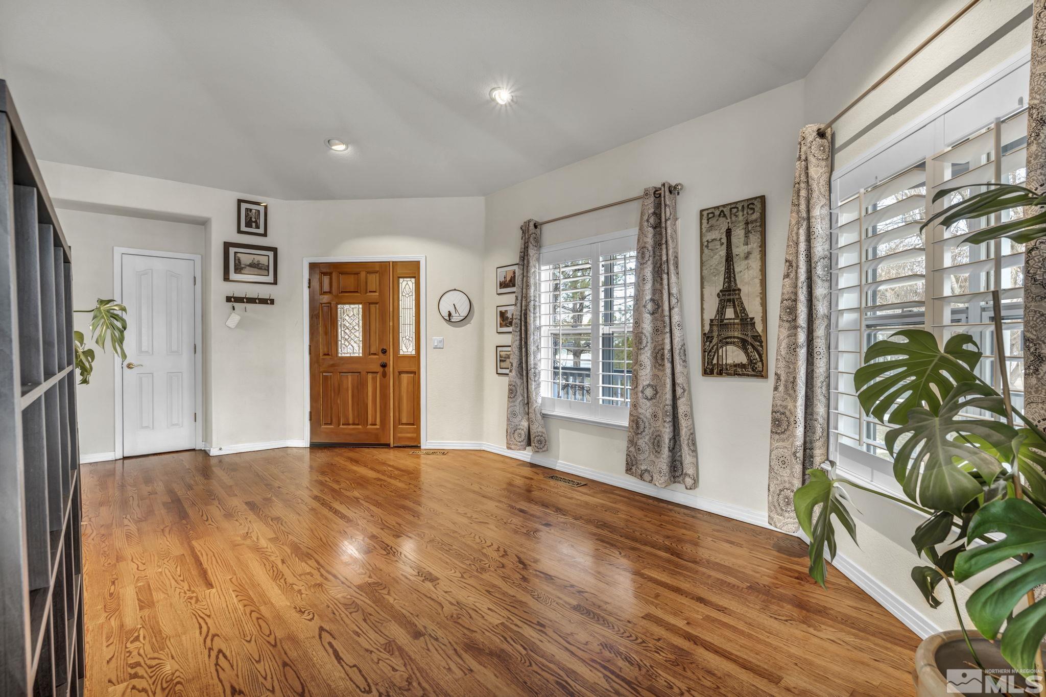 9811 Dixon Lane Reno, NV 89511 - Photo 6 of 40 a view of livingroom with furniture and wooden floor