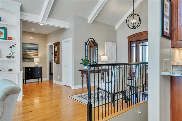 a spacious bathroom with a double vanity sink toilet and a mirror