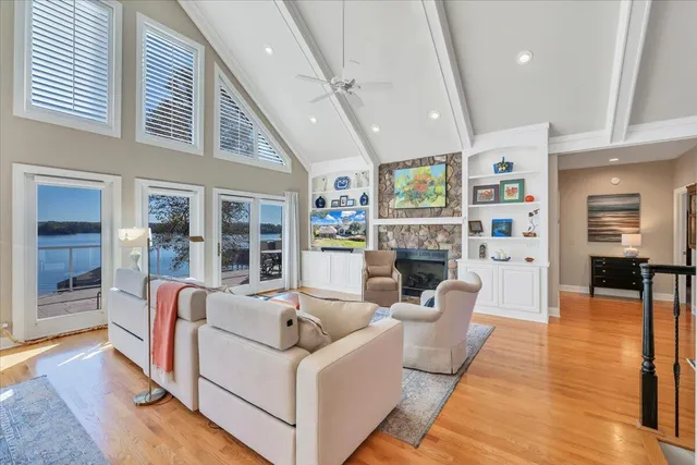 a spacious bathroom with a mirror a shower and a sink