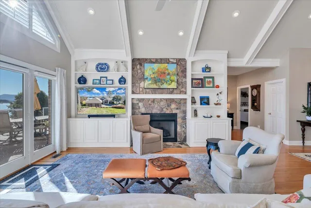 a bathroom with bathtub and window