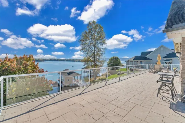 a living room with furniture kitchen view and a table