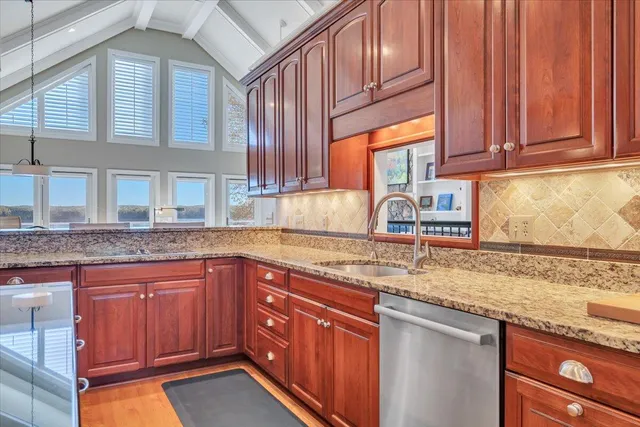 a view of a lake with couches and city view