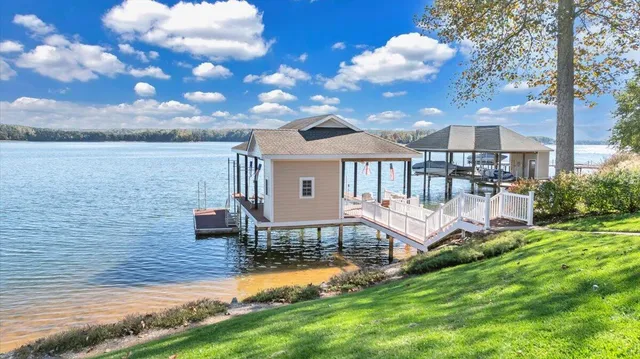 a living room with fireplace furniture and a wooden floor