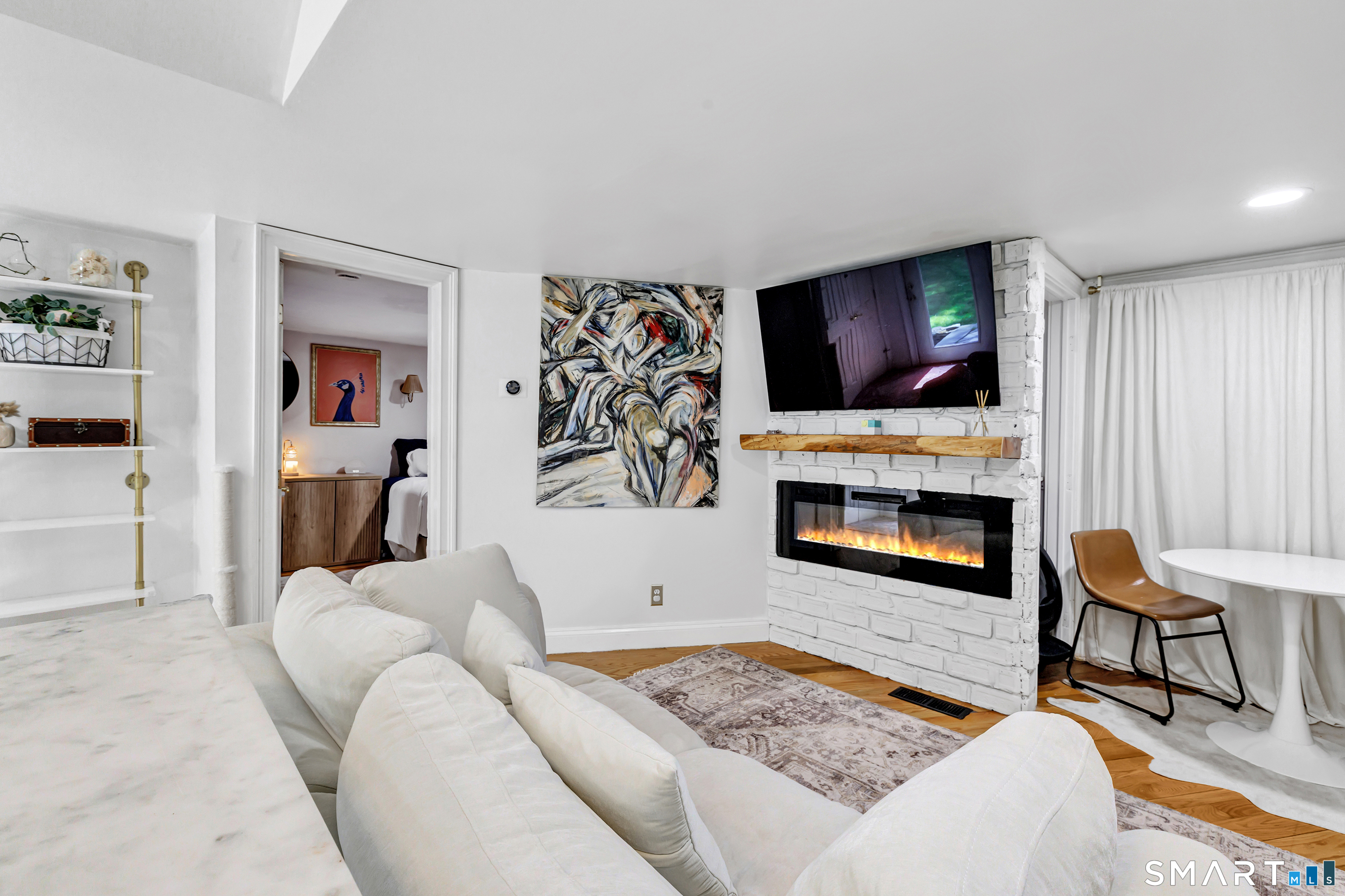 57 Olmstead Road Redding, CT 06896 - Photo 4 of 22 a living room with furniture and a flat screen tv