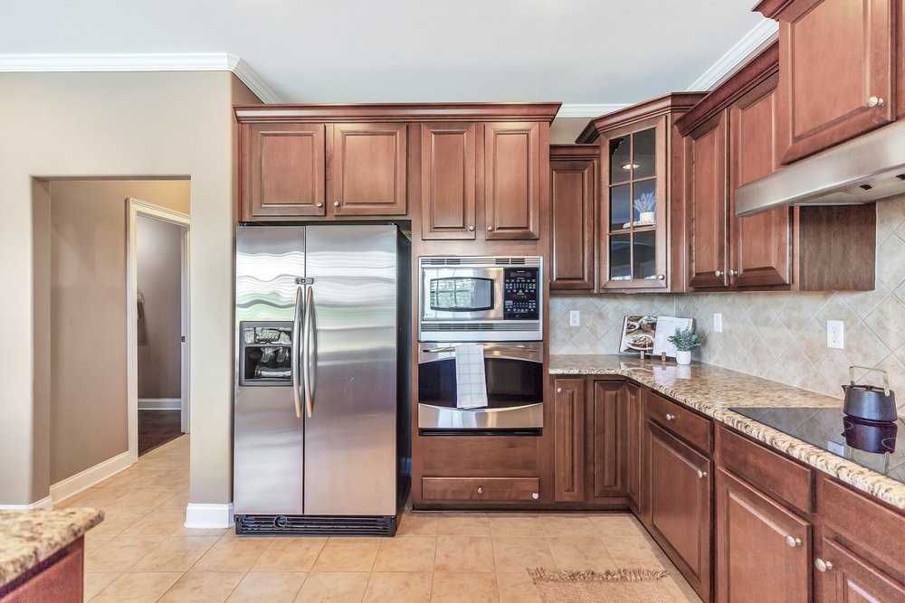 15 Fawn Hill Drive Anderson, SC 29621 - Photo 15 of 38 This functional kitchen features rich wooden cabinetry and modern stainless steel appliances.