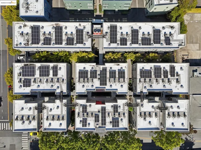 a view of building with large windows and a fountain
