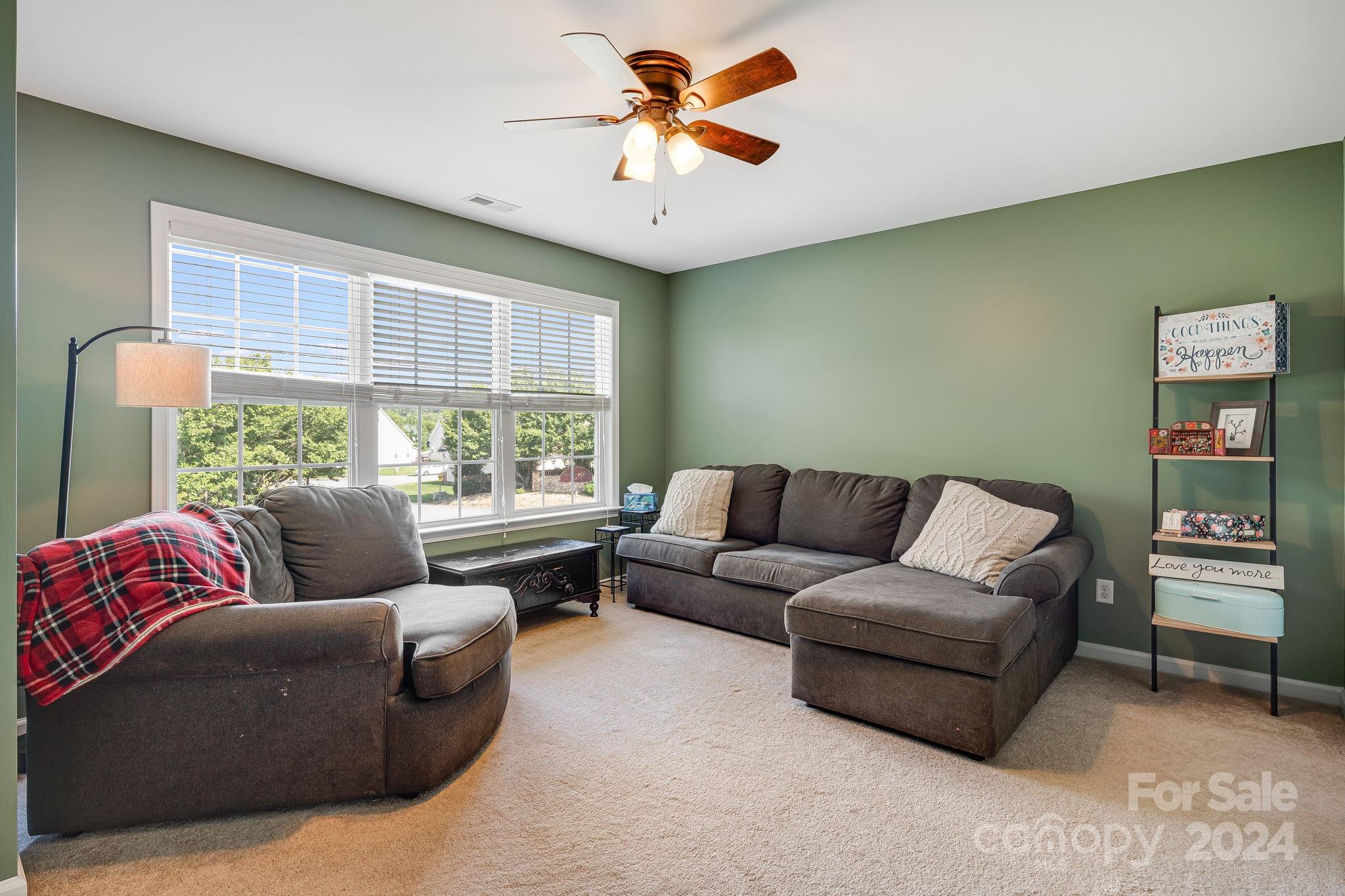 101 Ledbetter Road Arden, NC 28704 - Photo 19 of 34 a living room with furniture and a large window