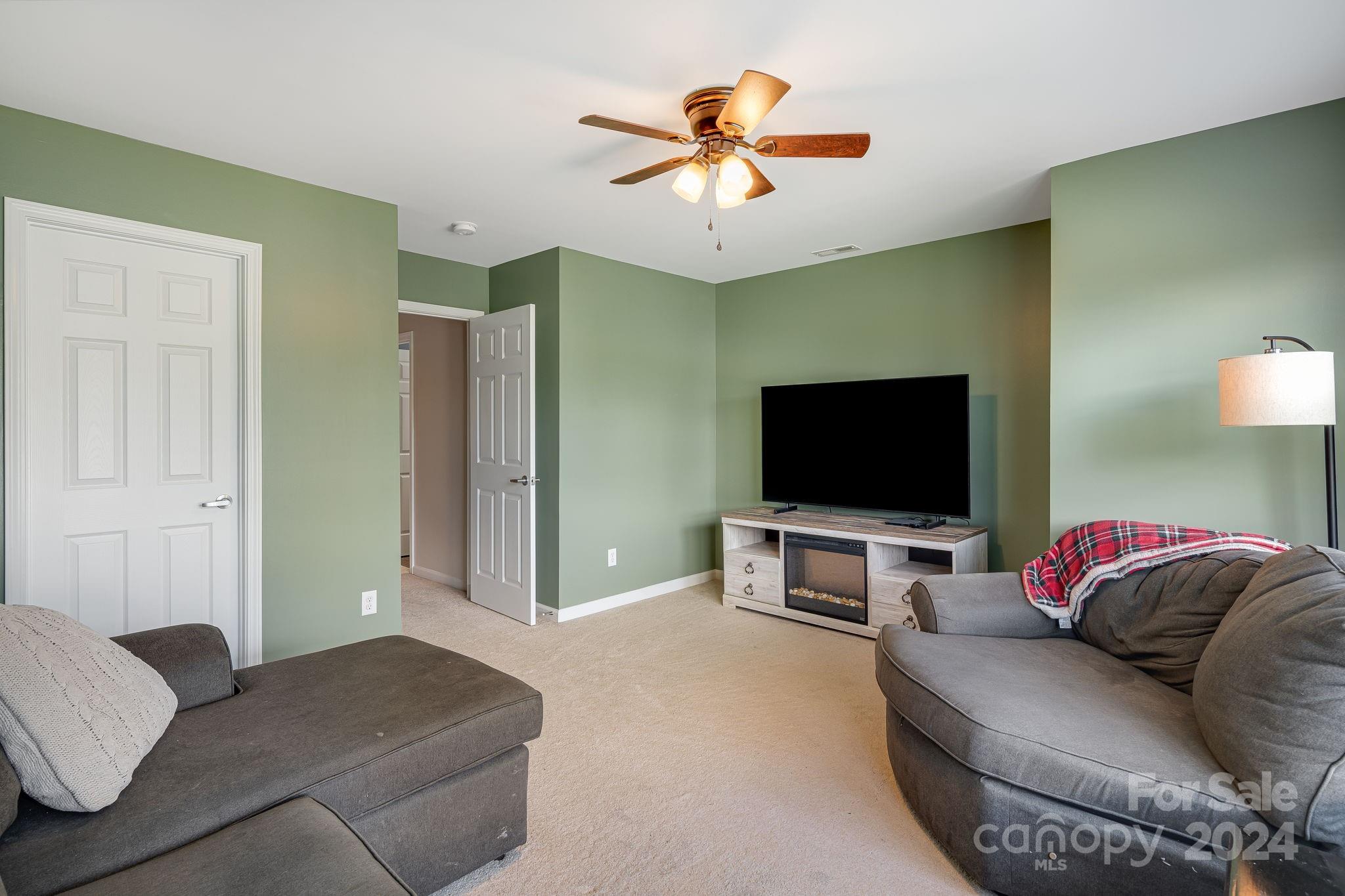 101 Ledbetter Road Arden, NC 28704 - Photo 20 of 34 a living room with furniture and a flat screen tv