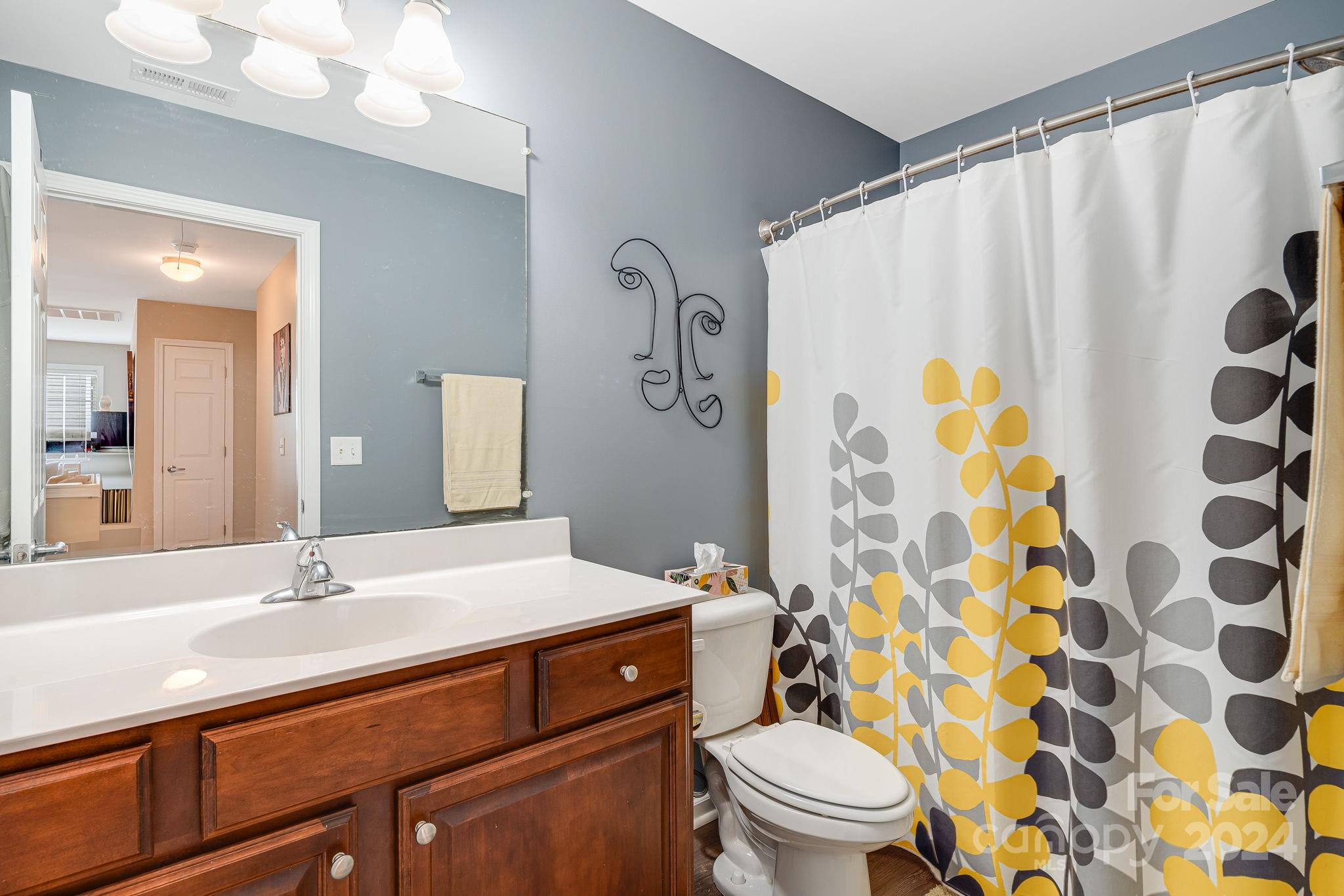 101 Ledbetter Road Arden, NC 28704 - Photo 23 of 34 a bathroom with a sink and a mirror