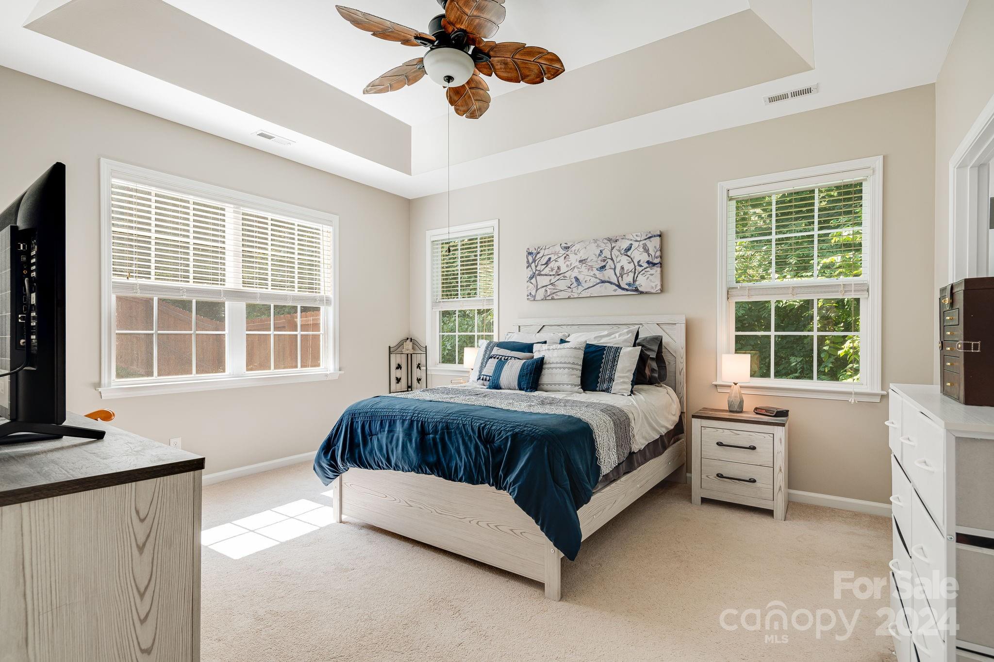 101 Ledbetter Road Arden, NC 28704 - Photo 6 of 34 a spacious bedroom with a large bed and a window