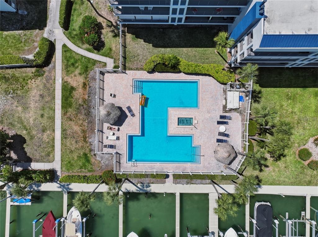 363 Pinellas Bayway South, Unit 29 Tierra Verde, FL 33715 - Photo 48 of 59 an aerial view of a house with a yard and lake view
