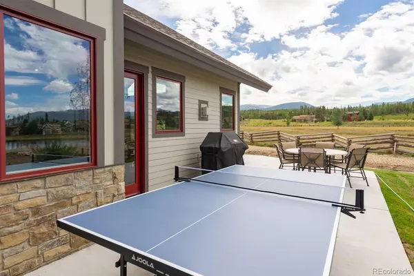 a view of a balcony with chairs and a table