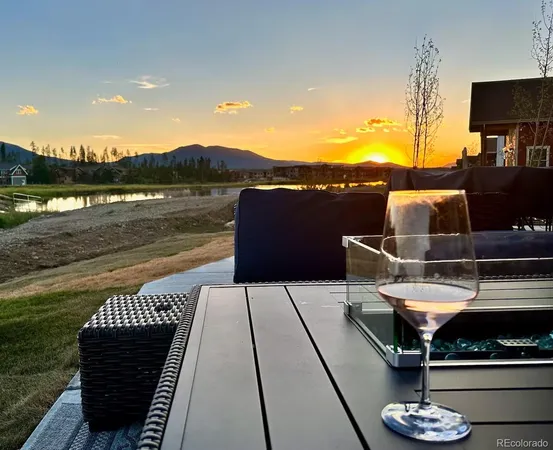 a terrace with outdoor seating and city view