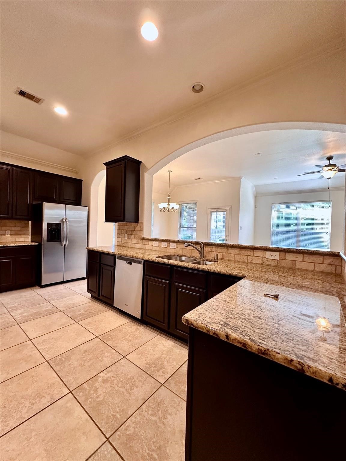 175 West New Harmony Trail Spring, TX 77389 - Photo 5 of 16 a kitchen with stainless steel appliances kitchen island granite countertop a sink and cabinets