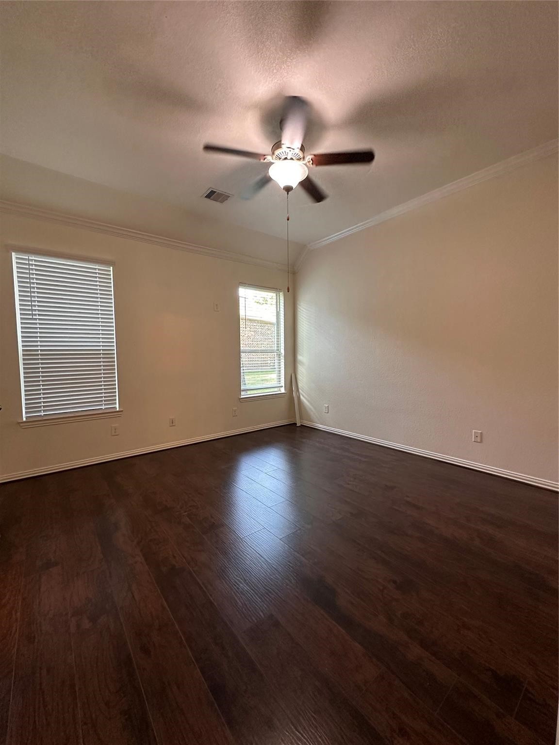 175 West New Harmony Trail Spring, TX 77389 - Photo 9 of 16 an empty room with wooden floor fan and windows