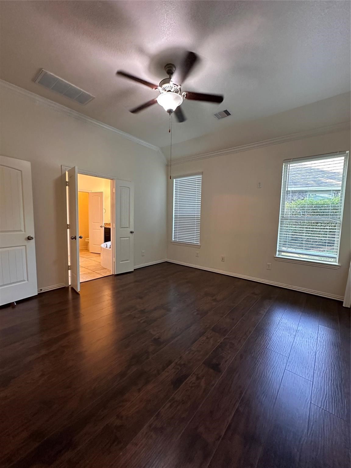 175 West New Harmony Trail Spring, TX 77389 - Photo 10 of 16 a view of an empty room with wooden floor and a window