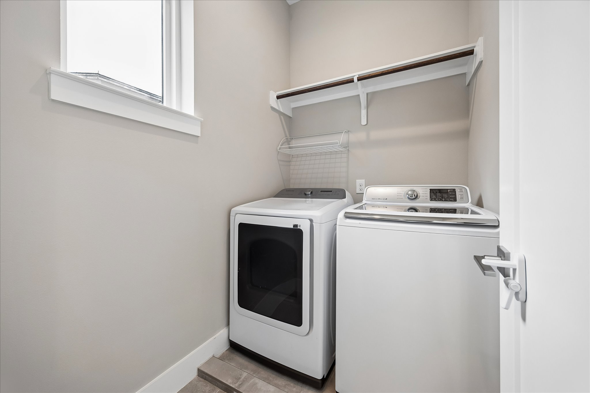5006 Pecan Springs Road, Unit 6 Austin, TX 78723 - Photo 25 of 30 A dedicated utility space for household chores with convenient overhead storage.
