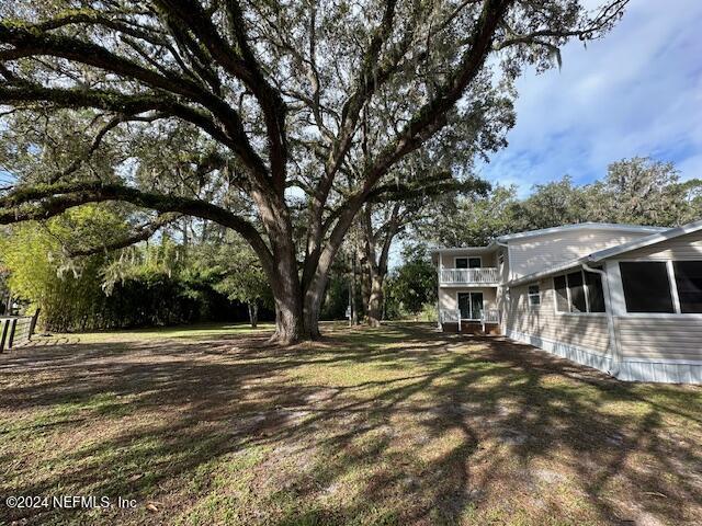 4779 Southwest 119th Loop Lake Butler, FL 32054 - Photo 12 of 49 south side yard 2