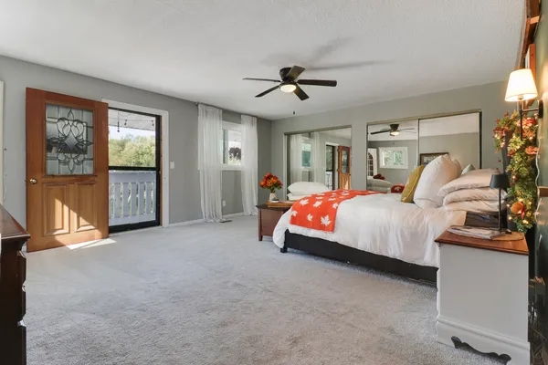 a bathroom with a toilet a sink and a mirror