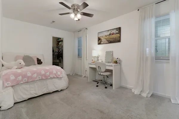 a bedroom with furniture and a bed