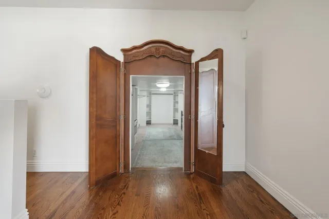 a view of walk in closet with white walls