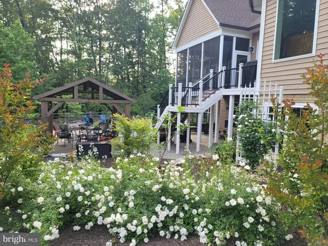 a pathway of a house with a yard