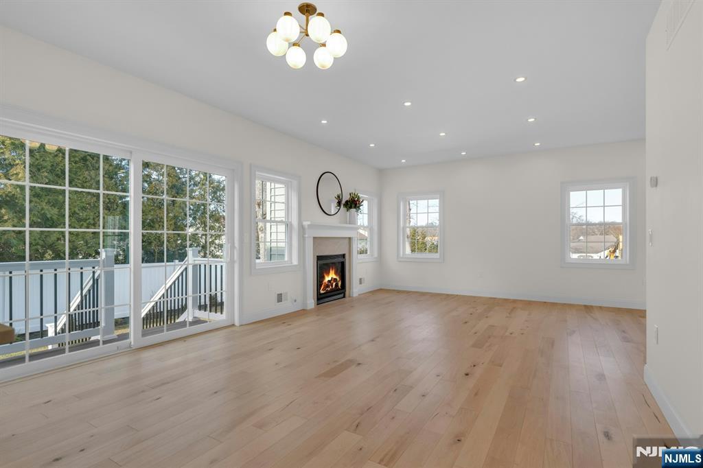 2127 Locust Road Sea Girt, NJ 08750 - Photo 13 of 48 a view of an empty room with a fireplace and a window