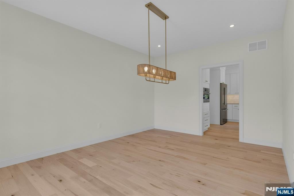 2127 Locust Road Sea Girt, NJ 08750 - Photo 23 of 48 a view of an empty room with a kitchen