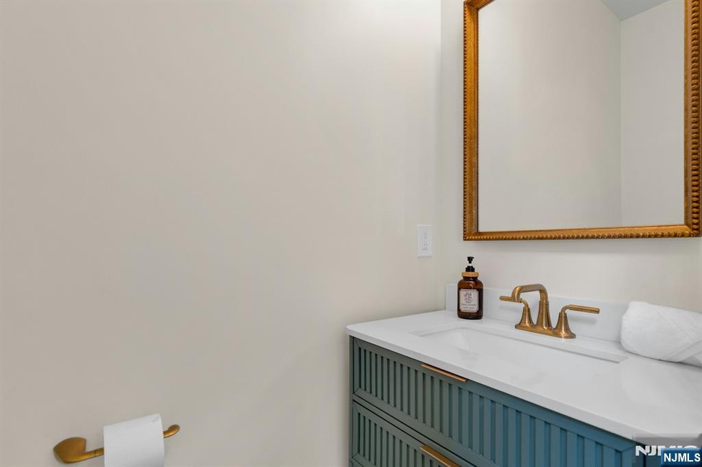 2127 Locust Road Sea Girt, NJ 08750 - Photo 25 of 48 a bathroom with a sink and a vanity