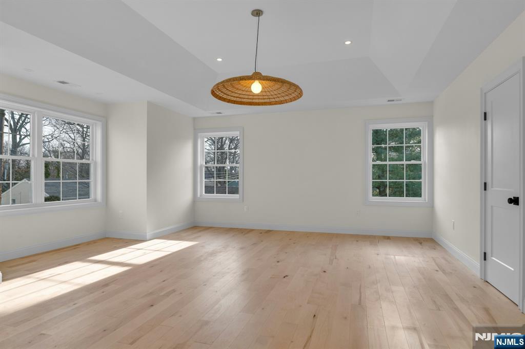 2127 Locust Road Sea Girt, NJ 08750 - Photo 30 of 48 an empty room with wooden floor and windows
