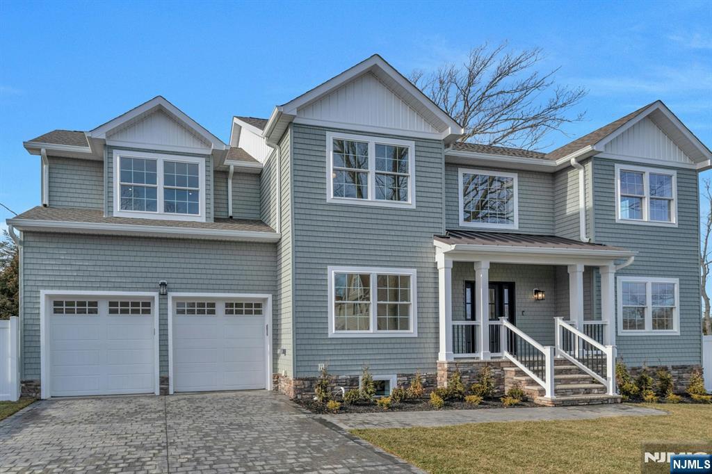 2127 Locust Road Sea Girt, NJ 08750 - Photo 3 of 48 a front view of a house with garden