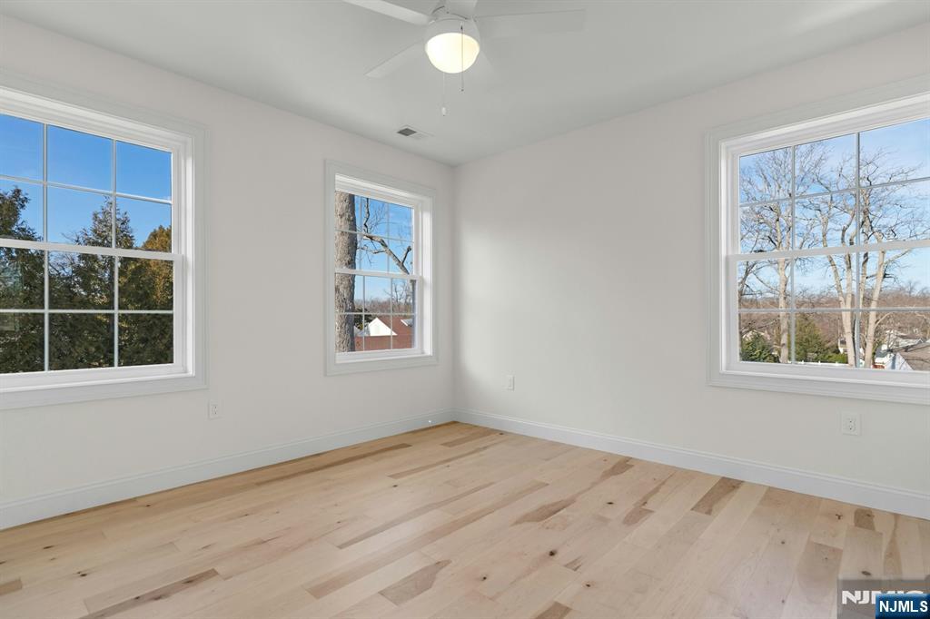 2127 Locust Road Sea Girt, NJ 08750 - Photo 40 of 48 a view of empty room with window and wooden floor