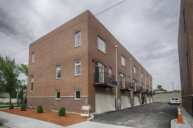 a front view of a building with street view
