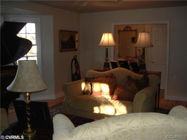 301 Wilkinson Road Richmond, VA 23227 - Photo 4 of 16 a living room with furniture and a lamp