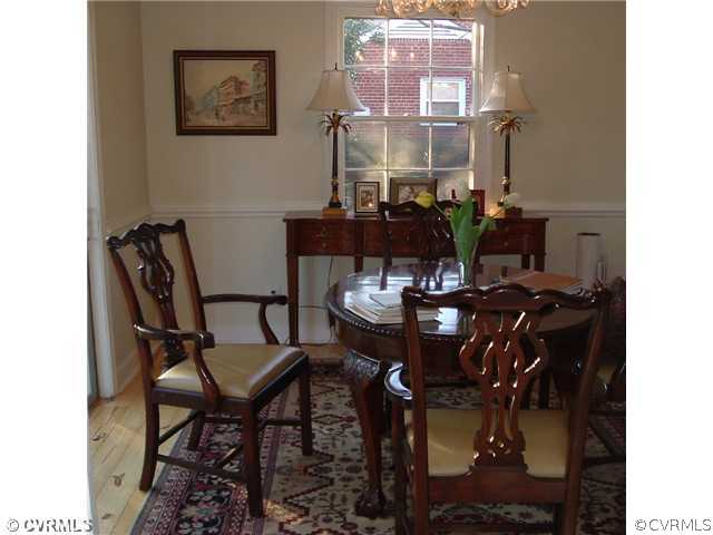 301 Wilkinson Road Richmond, VA 23227 - Photo 9 of 16 a view of a dining room with furniture and chandelier
