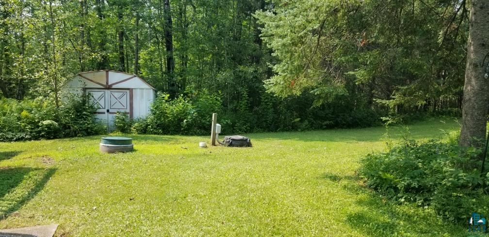 4179 Willard Road Rice Lake, MN 55803 - Photo 31 of 39 View of yard featuring a shed